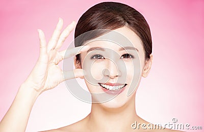 Closeup young beauty and eye looking through fingers Stock Photo