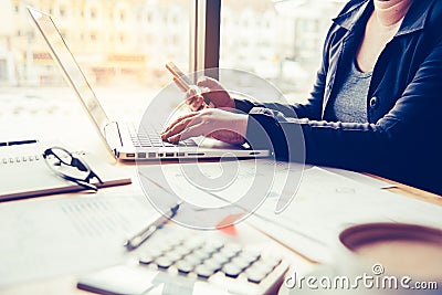 Closeup young business working with for smartphone and laptop Stock Photo