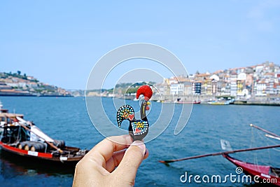 Man with a Rooster of Barcelos, emblem of Portugal Stock Photo