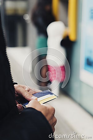 Man about to withdraw money from an ATM Stock Photo