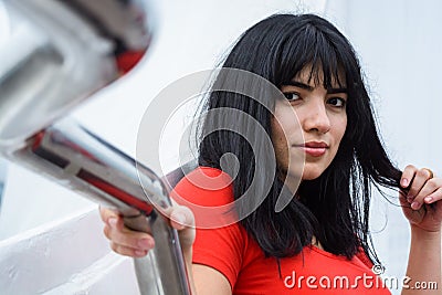 closeup of young tourist woman outdoors calm looking at the camera Stock Photo