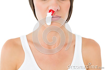 Closeup of a young woman with bleeding nose Stock Photo