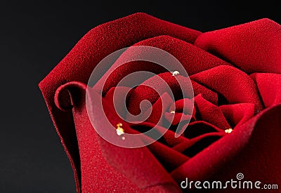 Closup of rose flower shaped cake on dark background Stock Photo