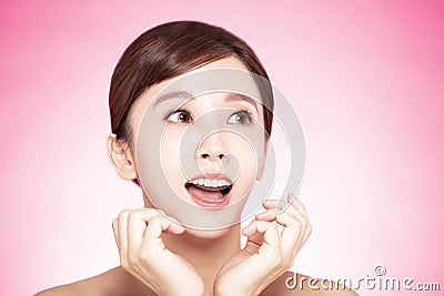 Closup surprised young beauty face looking up Stock Photo