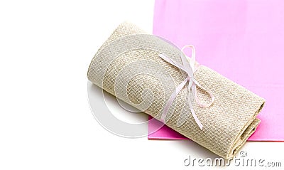 Cloth bundle and pink paper bag isolated on white Stock Photo