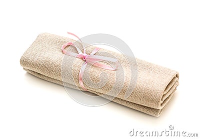 Cloth bundle, tied with a pink ribbon, isolated on white Stock Photo