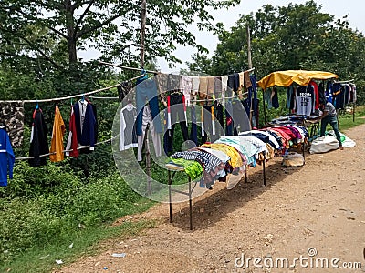 A cloth shope situated near highway. Stock Photo
