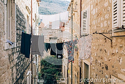 Clothes dries on ropes on clothespins Stock Photo