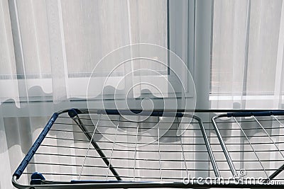 Clothes Dryer Metal Rack Laundry Home near window Stock Photo