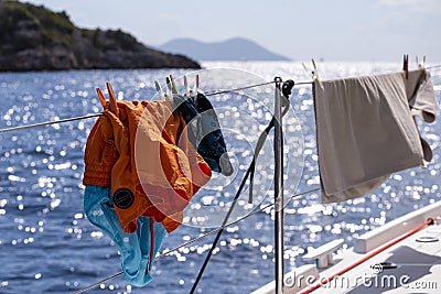 Clothes drying on a Catamaran deck Stock Photo