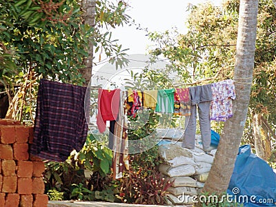 Clothes drying riverside homes Stock Photo
