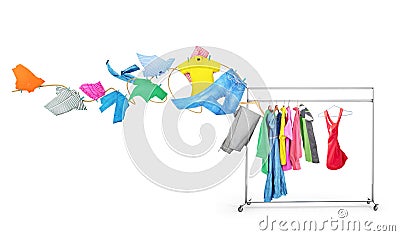 Clothes fly off the clothesline on a hanger. Stock Photo