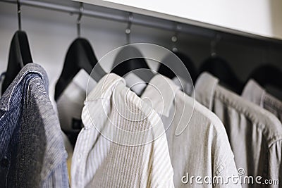 Clothes hanging in Closet Shop Fashion display Stock Photo