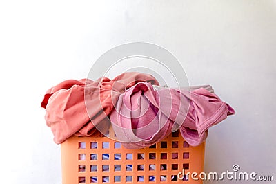 Clothes that have already been worn and placed in a basket Stock Photo