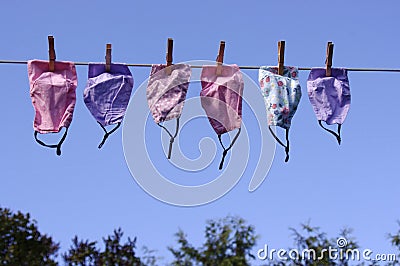 Clothes line full of face masks Stock Photo