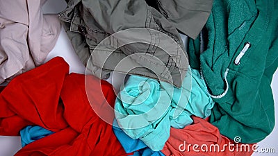 Clothes lying on ground, choosing what to wear, lack of choice, shopaholism Stock Photo