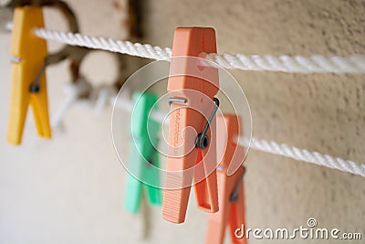 Clothes pegs on a rope Stock Photo