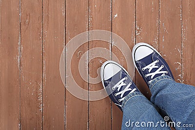 Clothes, shoes and accessories - gumshoes and blue jeans top vie Stock Photo