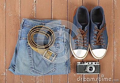 Clothes, shoes and accessories - Top view belt, gumshoes, camera Stock Photo