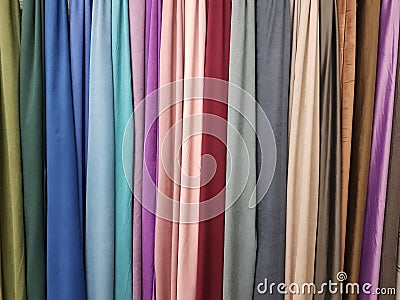 Clothes stack. Bright colourful fabric Stock Photo