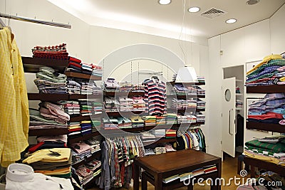 Clothes in store and changing room Stock Photo