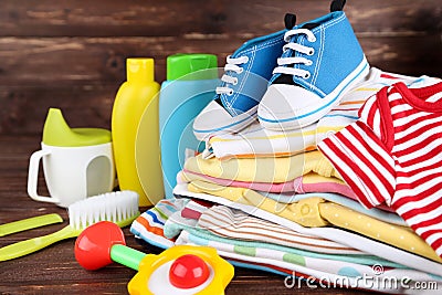 Clothes with toy and baby supplies Stock Photo