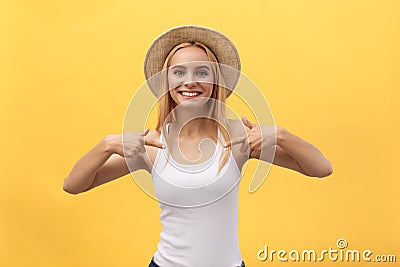 Clothing, design and advertising concept. Indoor shot of positive friendly young female pointing at copy space on her Stock Photo