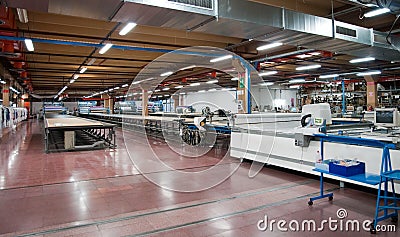 Clothing factory - Automatically cutting textile Stock Photo