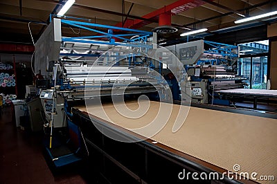 Clothing factory - Automatically cutting textile Stock Photo