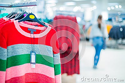 Clothing on hanger at the modern shop, mass market. Make Outfit set. Shopping Mall. Shopper. Sales. Shopping Center. Selective Stock Photo