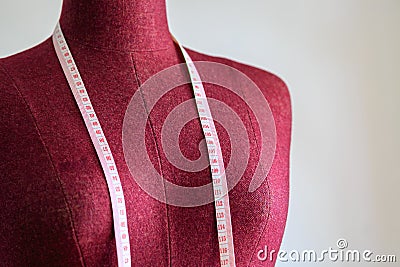 Clothing mannequin with measuring tape Stock Photo