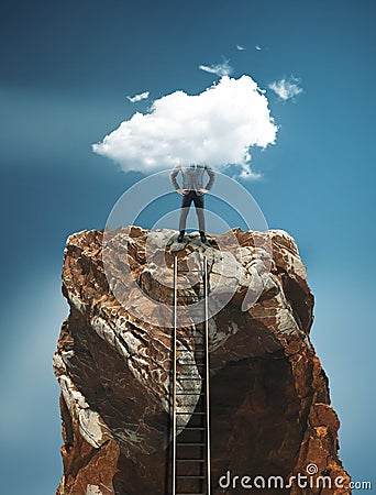 Ladder leading to the top of a mountain rock and a businessman Stock Photo