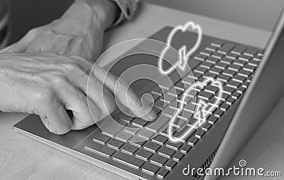 Cloud computing. Man using laptop for download files from online storage. Forefinger closeup pressing on enter button Stock Photo