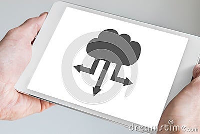 Cloud computing symbol for upload and download displayed on touch screen of modern tablet Stock Photo