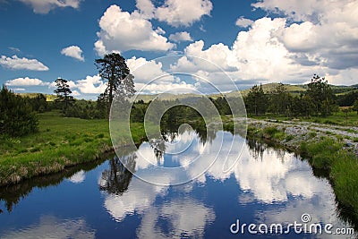 Cloud reflection i n Crni Rzav river Zatibor mountain Stock Photo