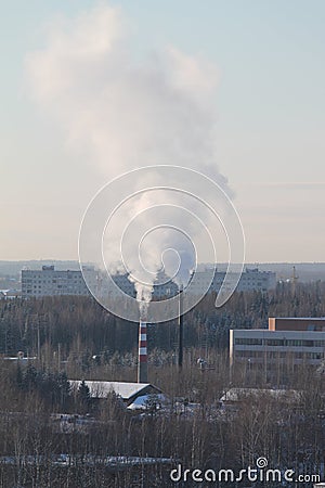 Cloud of smoke rising up from indastrial chimney Stock Photo