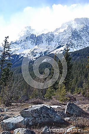 Cloud and Snow Covered Mountain Stock Photo