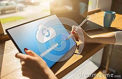 Cloud synchronization progress bar on tablet screen. Data storage and protection. Technology and internet concept. Stock Photo