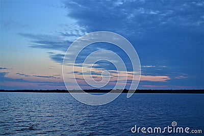 Clouded sunset over Shawano Lake Wisconsin. Stock Photo