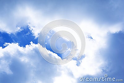 Clouds blue sky with sun lights coming behind bright vibrant spring autumn nature background photo in blue white gray colors Stock Photo