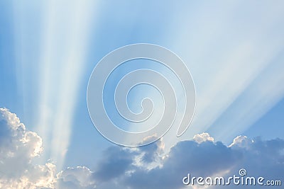 Clouds and a blue sky with a sunbeam shining through. Stock Photo