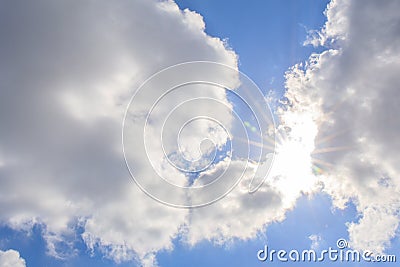 Clouds and blue sky with sunlight sunbeams or sunrays. Stock Photo