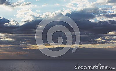 Clouds blue sky and sunlight sunset on horizon ocean. Ð¡loudscape on background seascape dramatic atmosphere rays sunrise. Relax Stock Photo