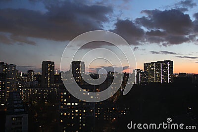 Clouds in a colorful sky at sunset in the city Stock Photo