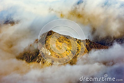 Clouds cover the mountain tops. Stock Photo