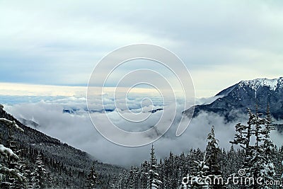 Clouds Covering A Mountain Valley Stock Photo