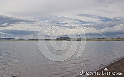 The clouds descended low over the lake Stock Photo