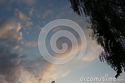 Clouds in the evening sky fascinate Stock Photo