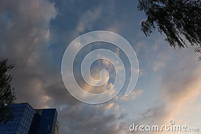 Clouds in the evening sky fascinate Stock Photo
