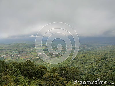 clouds forming above the forest before a good rain Stock Photo